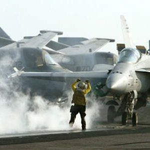 An F/A 18C Hornet prepares to take off from the flight deck of the USS Abraham Lincoln in 2002 in the Persian Gulf. The war planes had the mission to patrol the no-fly zone in southern Iraq.